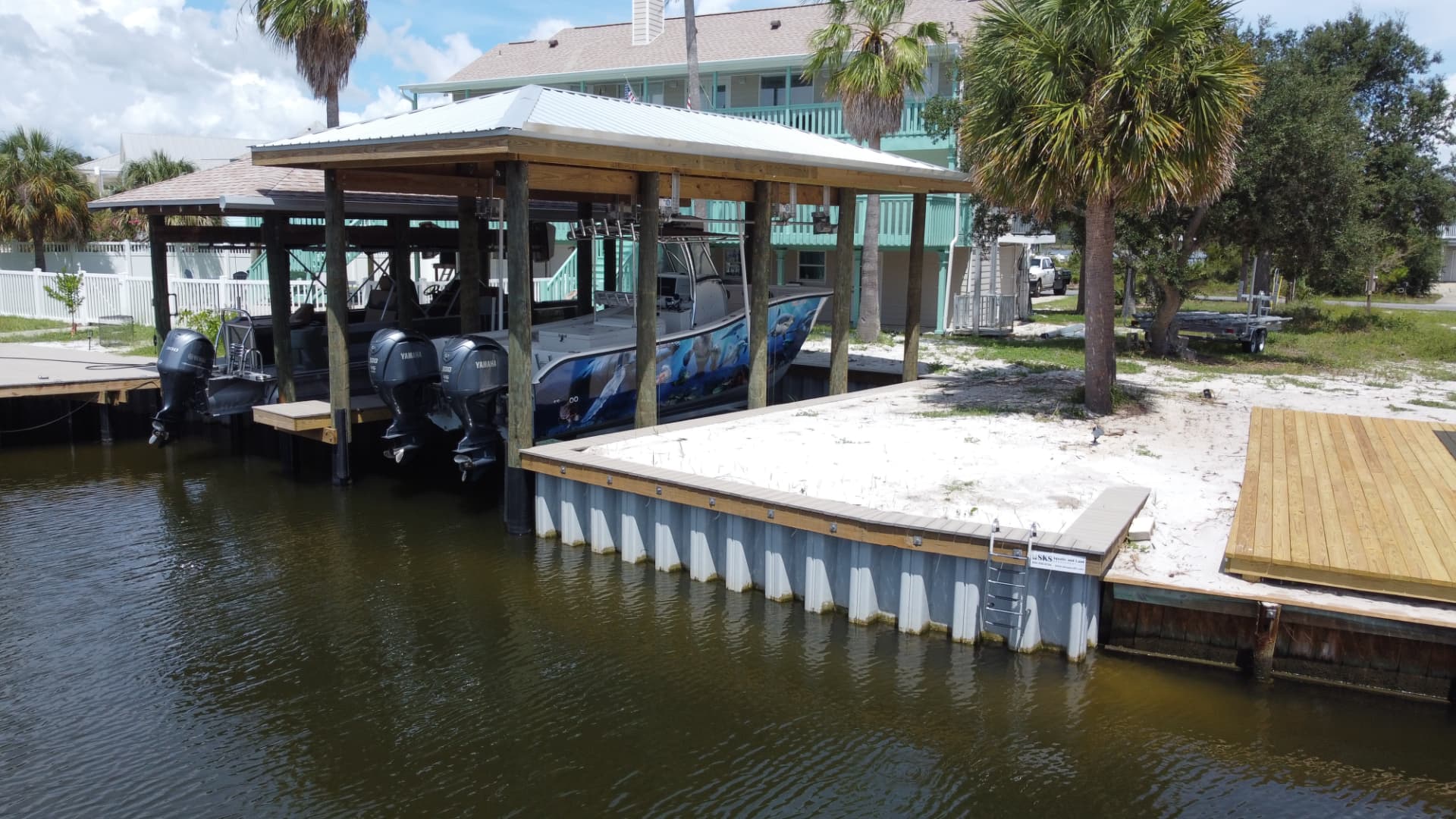 Completed SKS Aquatic boathouse, boat lift and vinyl seawall on the Gulf Coast