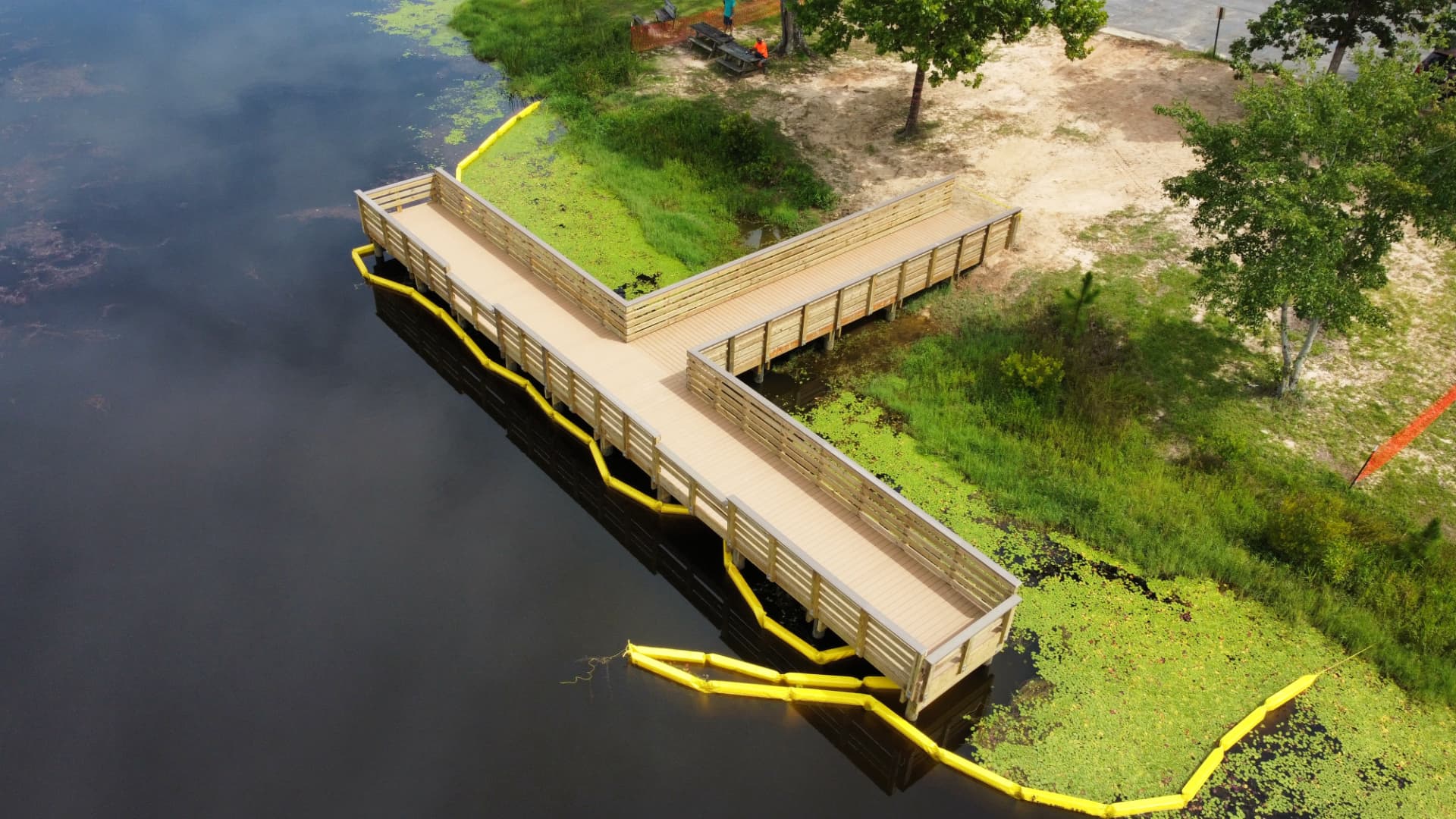 Aerial view of a T-shaped lake boardwalk built by SKS Aquatic