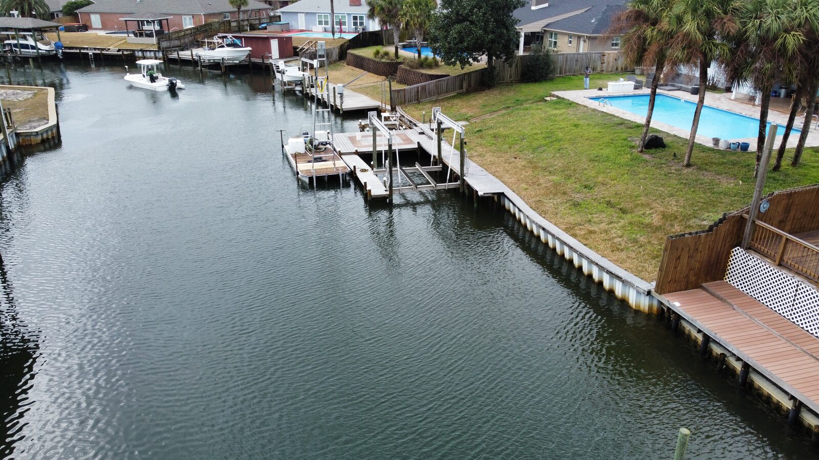 Aerial view of a coastal community stormwater pond and shoreline