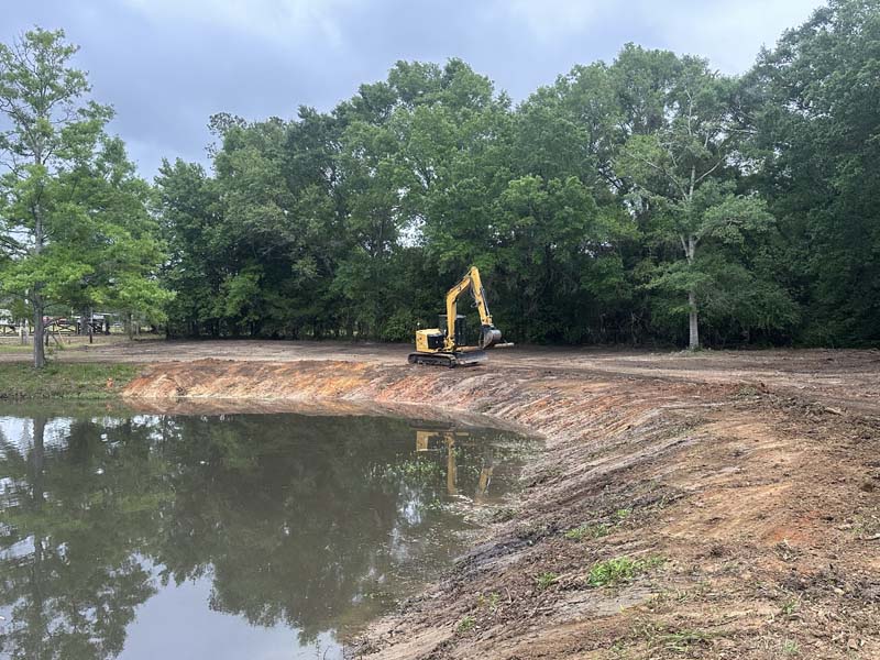 SKS Aquatic excavator grading a newly constructed pond bank